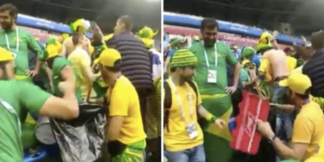 Brasileiros juntam o lixo em estádio depois da vitória da seleção