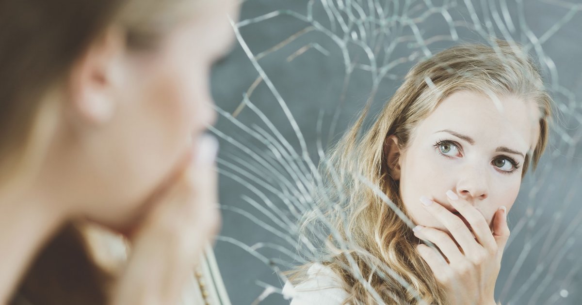 Girl and broken mirror