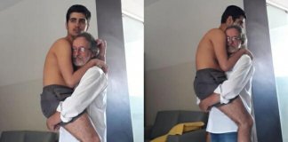 Avô com neto autista de 17 anos no colo viraliza na net