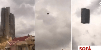 Um sofá voador aparece pairando no céu entre prédios na Turquia
